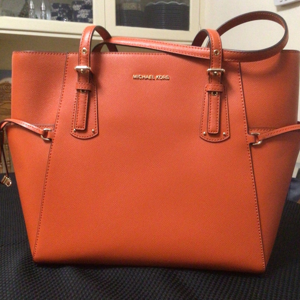 Michael Kors “Voyager” burnt orange commuter tote